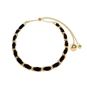 Adjustable black choker necklace with gold metal woven chain and double ball pendants