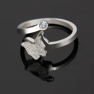 Macro shot of silver butterfly ring with micro-pave crystals and single round diamond
