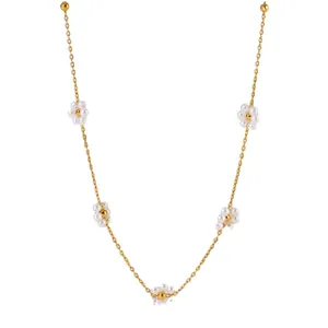 Golden titanium steel necklace with white pearl flower charms in a delicate design
