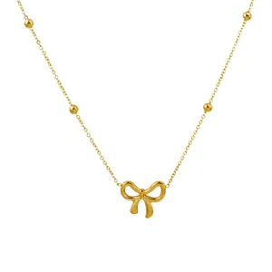 Elegant gold titanium steel bow necklace with beaded chain and hollow pendant design