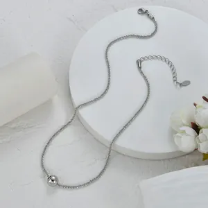 Detail of silver beaded ball pendant necklace with lobster clasp and adjustable chain