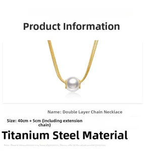 Close-up of double layer titanium steel gold chain necklace with a white pearl pendant