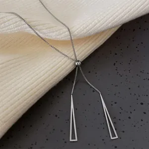 Minimalist silver geometric triangle pendant necklace with adjustable box chain on knit