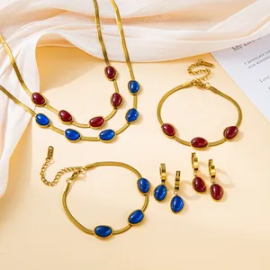 Vintage 18K gold-plated jewelry set with emerald and ruby cabochon stones on snake chains