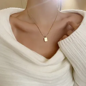 Elegant gold titanium steel necklace featuring a rectangular Chrome engraved pendant