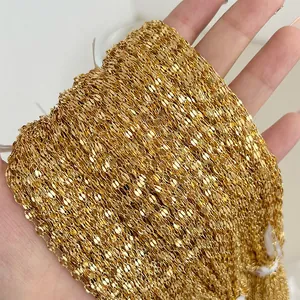 Macro shot of gold-plated stainless steel flat O-chain texture and link details