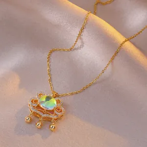 Macro shot of titanium steel longevity lock pendant with opal stone and tiny bells