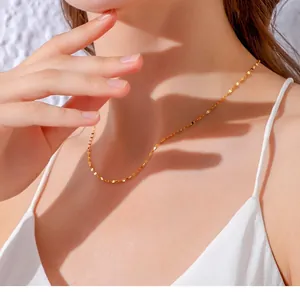 Minimalist gold titanium steel O-chain necklace worn by female model for elegant look
