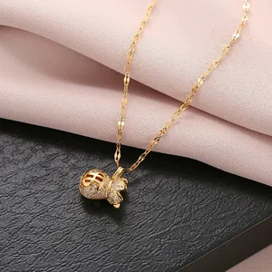 Elegant gold titanium steel necklace with a crystal-studded money bag pendant for women