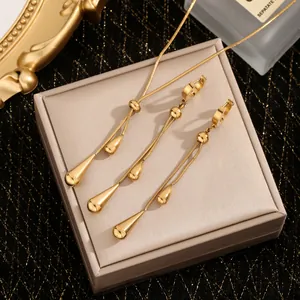 Elegant gold teardrop jewelry set with adjustable snake chain necklace and tassel earrings