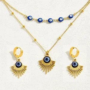 Minimalist evil eye jewelry set with double-layered necklace and matching gold earrings