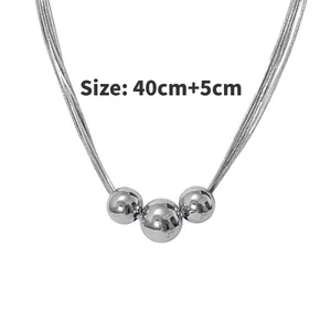 Detailed view of silver triple-bead necklace featuring 40cm chain plus 5cm extender