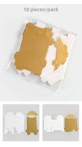 Detalle de los componentes de la caja de regalo DIY con forma de casa, blanco y dorado