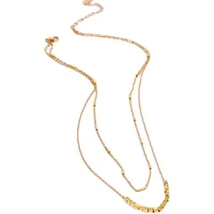 Minimalist double-layered gold necklace with beaded charms and elegant tubular accents