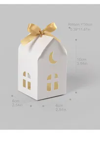 Detailed view of white paper candy gift box with gold ribbon and size dimensions