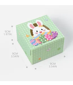Detail view of green polka dot Easter gift box with cute rabbit and egg patterns