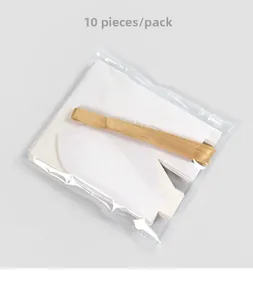 Detailed set of 10 white hollow house gift boxes with gold ribbons in packaging