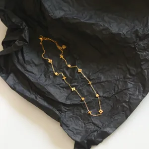 Elegant gold four-leaf clover and star titanium steel necklace with adjustable chain