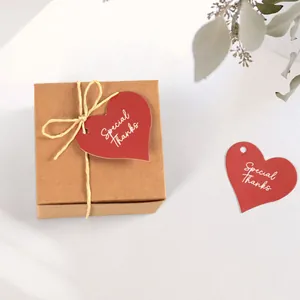 Special Thanks red heart tags on kraft paper gift box with twine ribbon and dry leaves