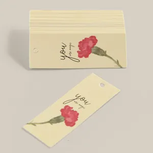Detail of floral gift tags featuring carnation art and You Are Magic text for packaging