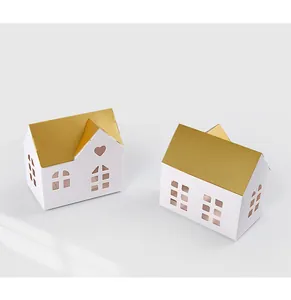 Detailed view of hollow gift box with golden roof and heart cutout for candies