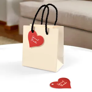 Gift set with off-white paper bag and red heart tags printed with Special Thanks text