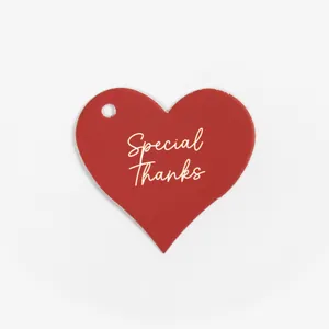 Red heart-shaped gift tags with Special Thanks gold lettering for gift packaging