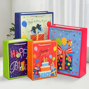 Set of four colorful cartoon dinosaur birthday gift bags with silver braided handles