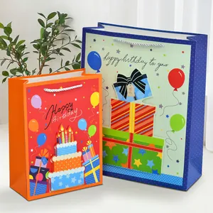 Colorful festive paper gift bags with birthday cake and balloons for party favors