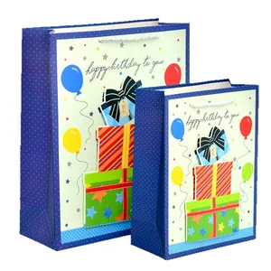 Glittery cartoon dinosaur birthday gift bags in two sizes with Happy Birthday text