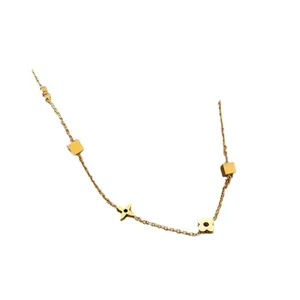 Luxury gold titanium steel necklace featuring star and four-leaf clover motifs for women