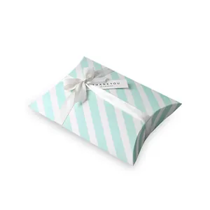 Elegant mint green striped pillow gift box with white satin ribbon and thank you tag