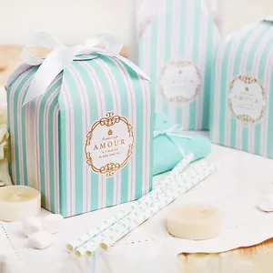 Elegant striped gift boxes with gold leaf detailing and luxury white satin ribbons