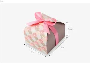 Detail of square gift box with pink ribbon bow and elegant pattern, 6x6x3.5cm