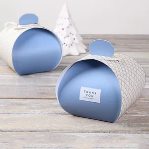 Close-up of light blue pillow-shaped gift boxes with lattice pattern and Thank You labels