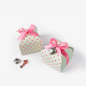 Mini floral gift box with pink bow ribbon and silver heart pendant for wedding favors