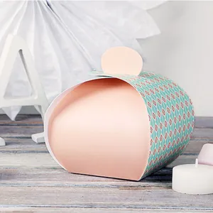 Detailed view of pink and teal argyle patterned gift box with elegant rounded top closure
