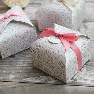 Close-up of mandala flower gift boxes with satin ribbons and you are special tags