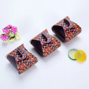 Detailed view of three colorful geometric pattern gift boxes for wedding candy packaging