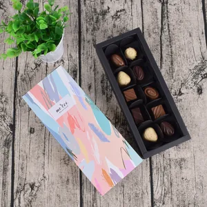Premium 10-piece chocolate gift box with colorful abstract art lid on wood background