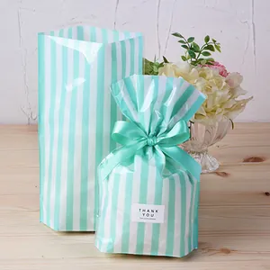 Mint green striped food packaging bags with Thank You labels and matching ribbons