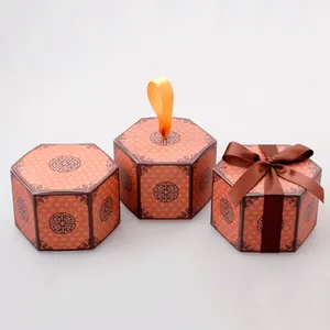 Traditional hexagonal gift boxes with classic Chinese patterns and silk ribbon handles