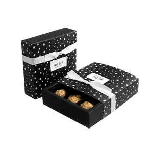 Black polka dot drawer gift box with white ribbon and internal tray for chocolates