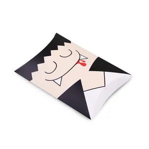 Detail of pillow-shaped Halloween gift box with cute vampire cartoon and blood drops