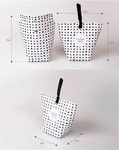 Polka dot paper gift bag with black ribbon handle and size dimensions 13x12x6cm
