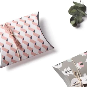 Mini forest style paper pillow boxes with decorative ribbons and tags for small gift packing
