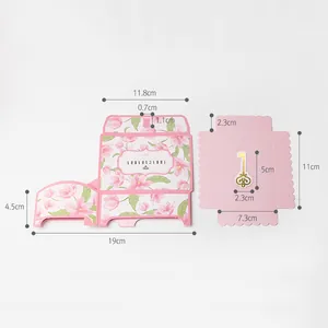 Floral pink foldable gift box flat lay with gold key tag and precise measurements