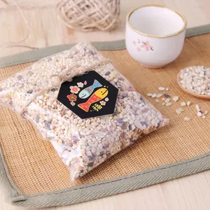 Hexagonal card with Fu character on multi-grain bag with hemp rope and minimalist aesthetic