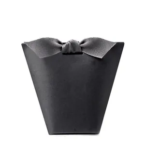 Elegant black trapezoid gift box with a matte finish and premium grey ribbon bow