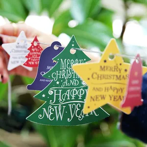 Christmas bell gift tags with Merry Christmas lettering for festive holiday decorations